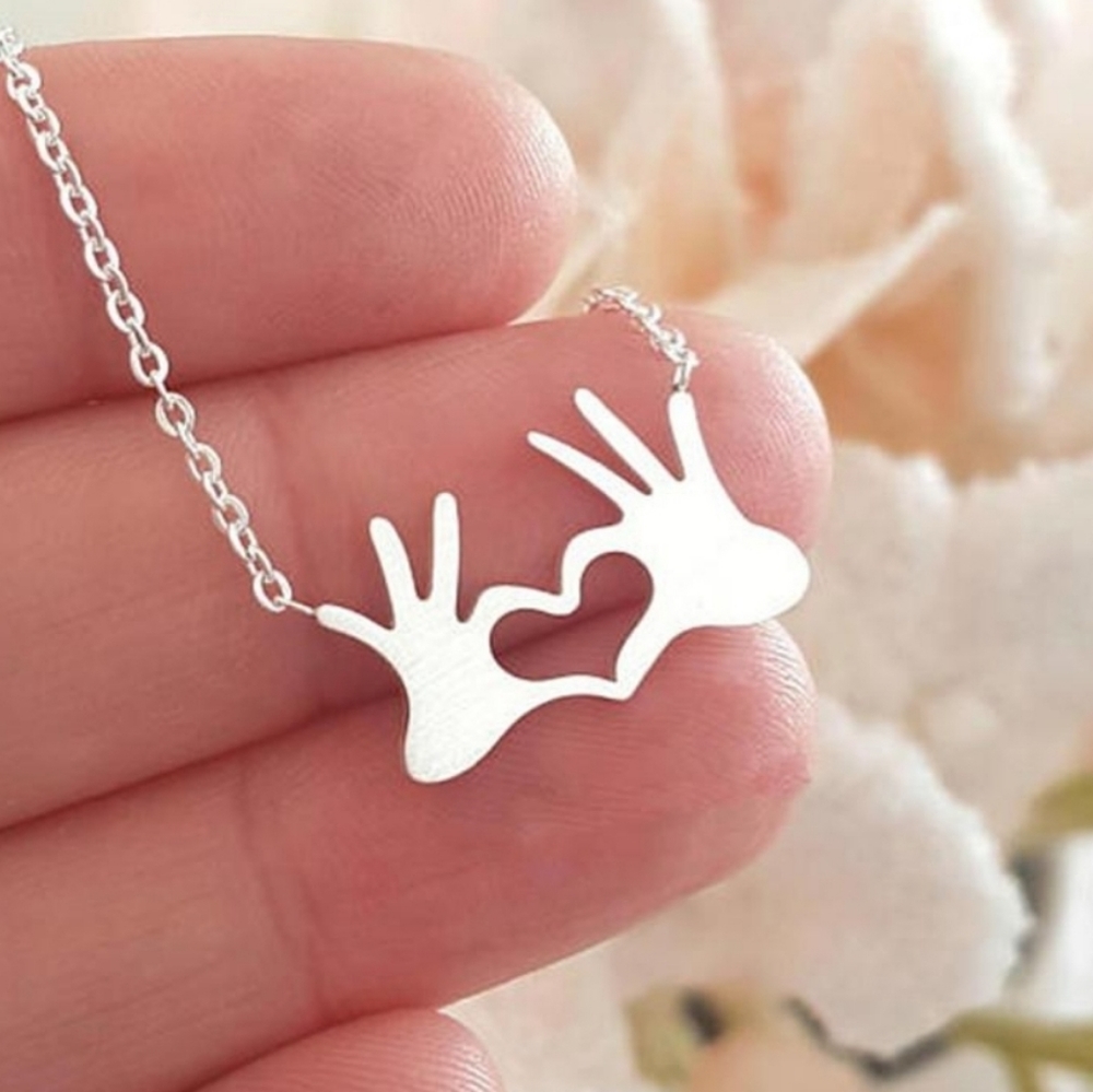 Silvertone Heart Hands necklace